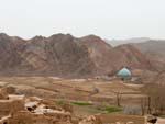 Kharanaq mud brick village with the turquoise mosque dome visible in the background
