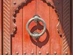 Red door at the entrance to Nizwa Souq