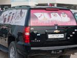 Decorated car with Emir and son on the back