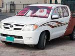 Decorated car with Emir and large Qatari flag