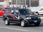 Decorated car with white and maroon coloured stickers