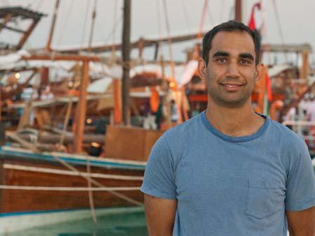 Travis with dhows in the background